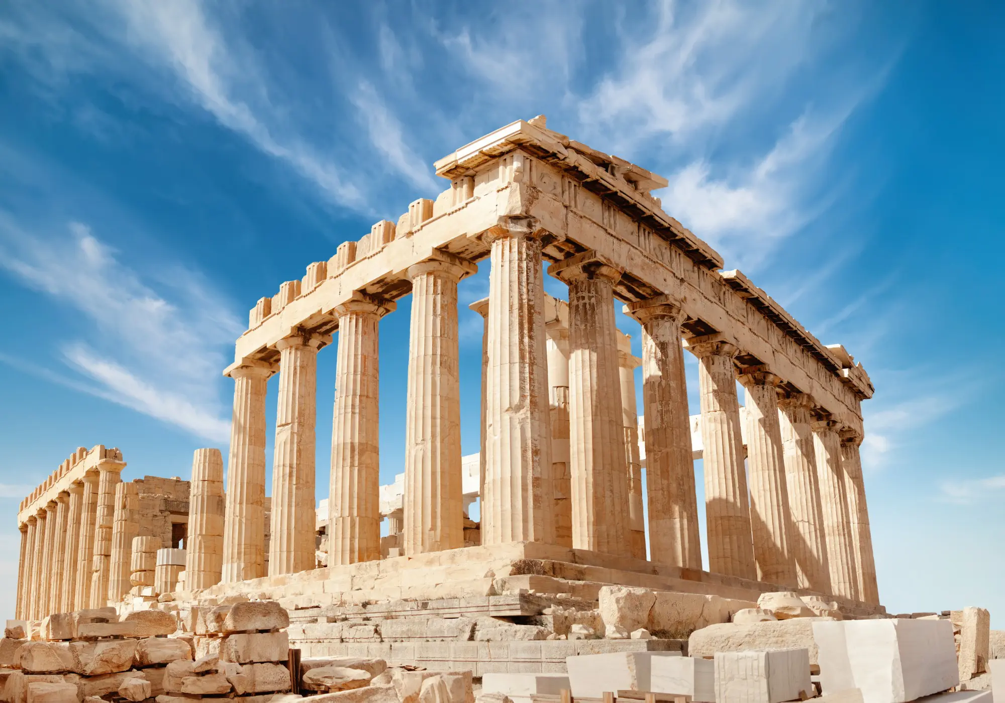 Ancient Greek Parthenon under blue sky.